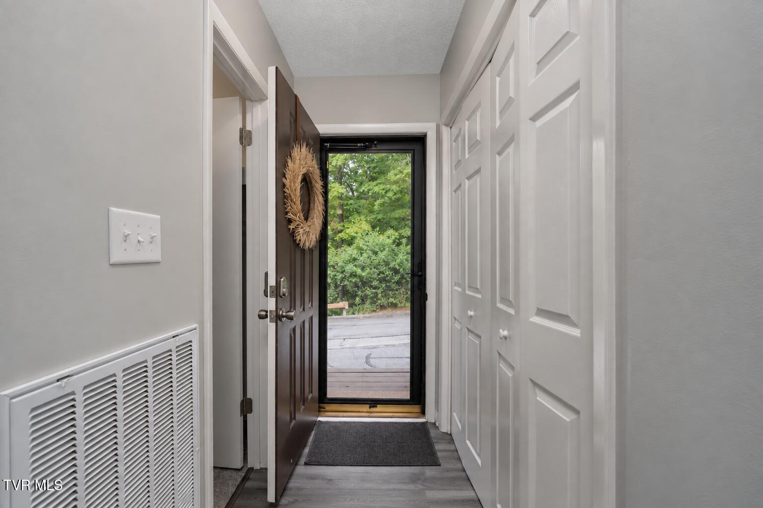 Open Front Door with Wreath