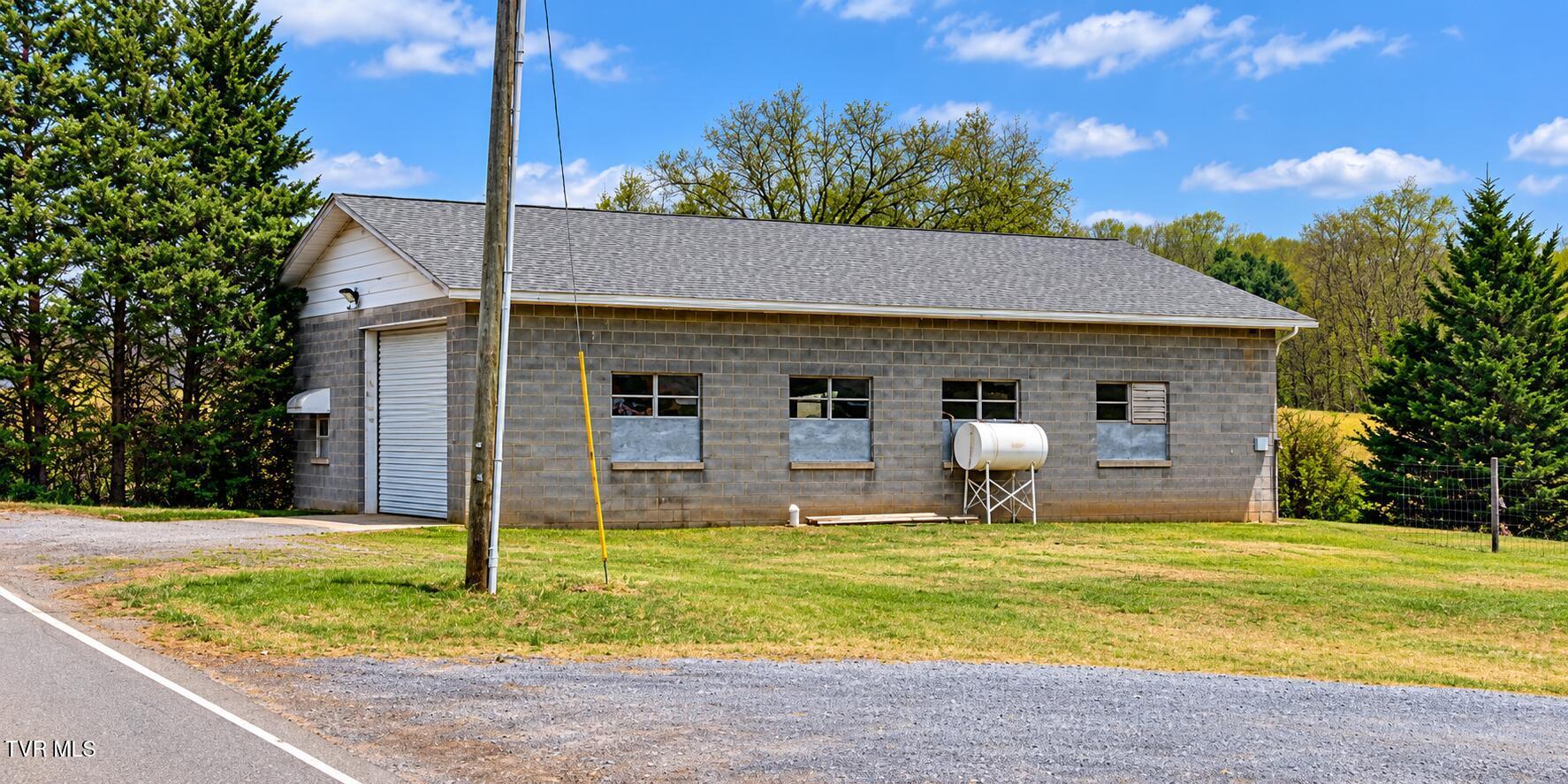 Rural Workshop Under a Bright Blue Sky